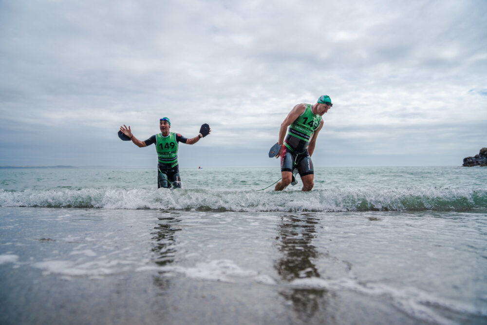 British swimrun - David Trehane and Ben Hallam exit the water at Hokey Cokey Swimrun Roseland